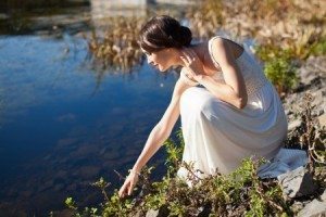 Woman Sitting Reaching Water Reflection Pond